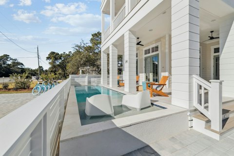 Cool off in the pool, then settle in on the covered porch