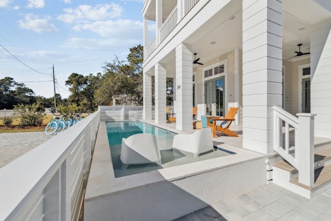 Cool off in the pool, then settle in on the covered porch