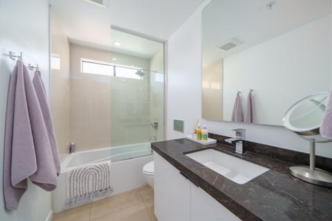 Sink back into soothingly warm water in the bathtub