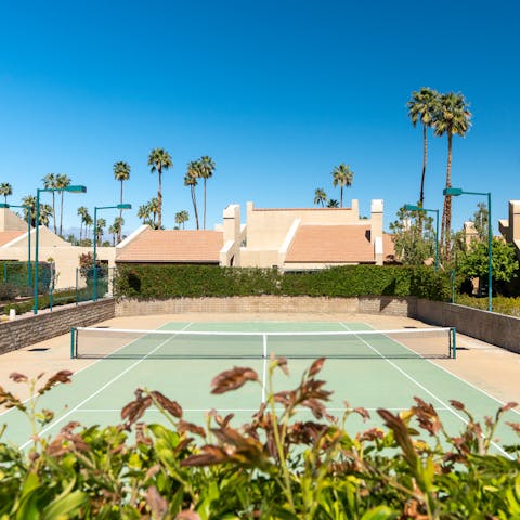 Show off your powerful serve on the pair of communal tennis courts