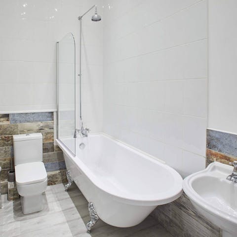 Treat yourself to a long soak in the clawfoot tub, a glass of bubbly in hand