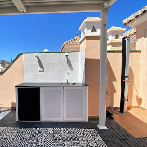 Whip up something tasty in the outdoor kitchen and wash off in the outdoor shower
