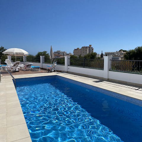 Head down to the communal pool for a dip in the cool blue waters