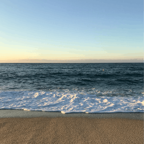 Splash along the shore of Plage de Juan les Pins – it's a fifteen-minute walk