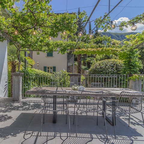 Enjoy a glass of Italian wine on the vine-covered terrace and admire the sunset