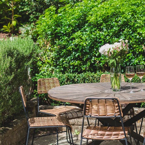 Enjoy an alfresco meal in the quaint cottage garden