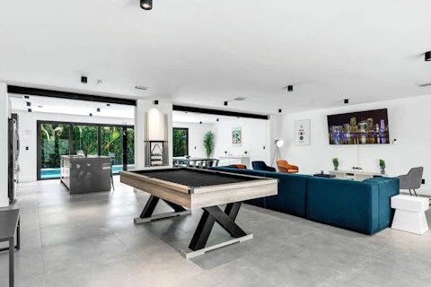 Challenge friends to a game of billiards before heading out to explore