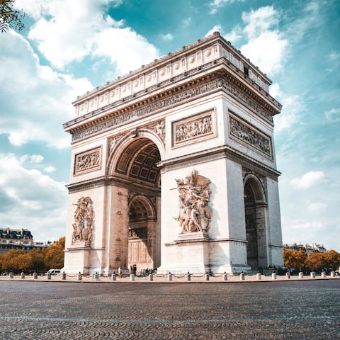Embrace the buzz of central Paris from the Arc de Triomphe