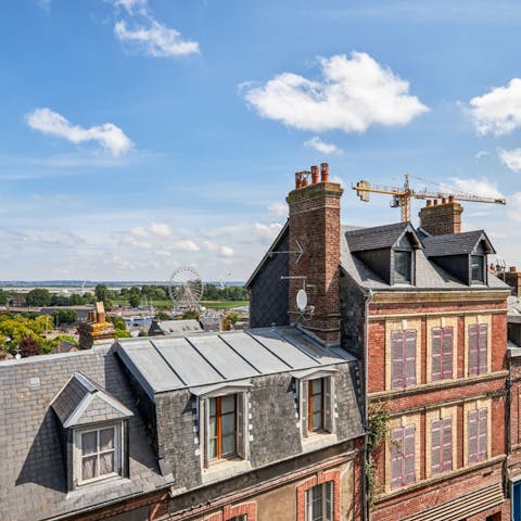 Gaze out over the neighbourhood rooftops towards the ferris wheel