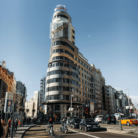 Admire the striking architecture along Gran Vía, right outside the door