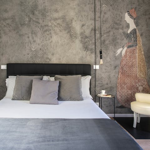 Get a restful night's sleep in the artsy bedroom with bold wallpaper prints