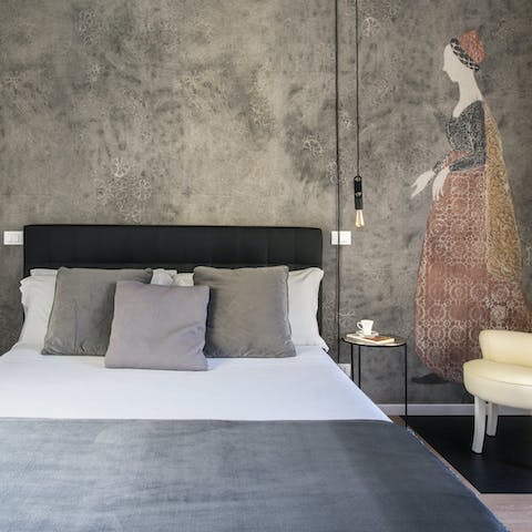 Get a restful night's sleep in the artsy bedroom with bold wallpaper prints