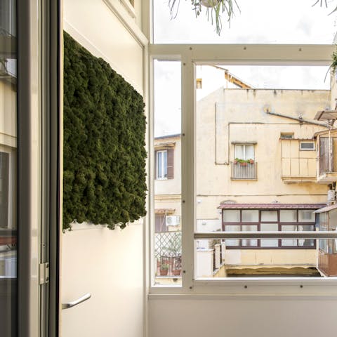 Sip your morning coffee on the home's leafy balcony