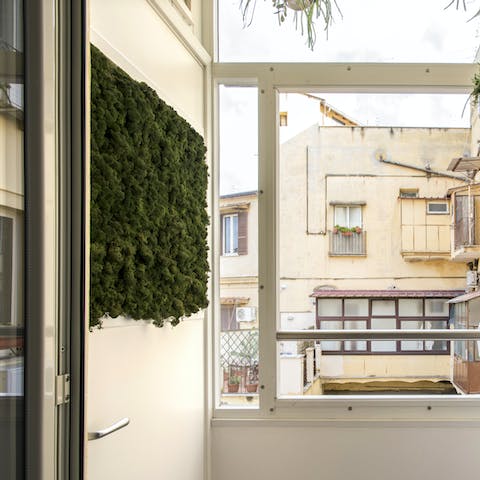 Sip your morning coffee on the home's leafy balcony