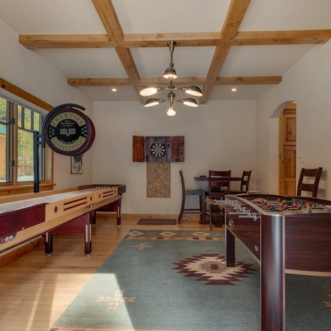 Play a round of shuffleboard in the games room