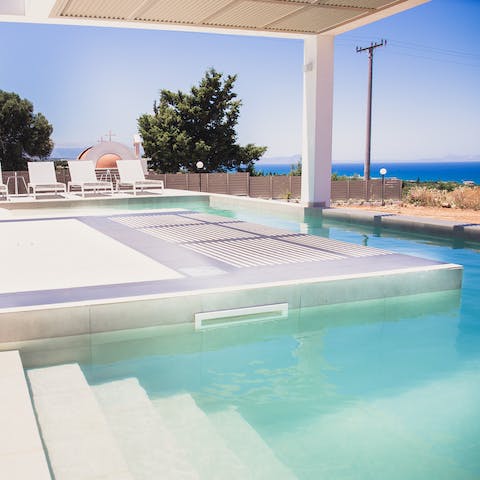 Step into the crystal clear waters of the private pool, and catch some sun on the poolside loungers