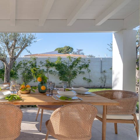 Dine alfresco at the outdoor table, perfect for an afternoon aperitivo