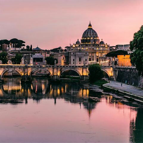 Take a twilit stroll along the banks of the Tiber, also a five-minute walk away