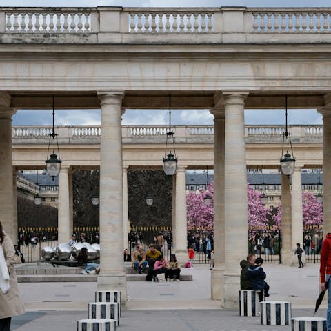Enjoy people watching at the nearby Jardin du Palais Royal
