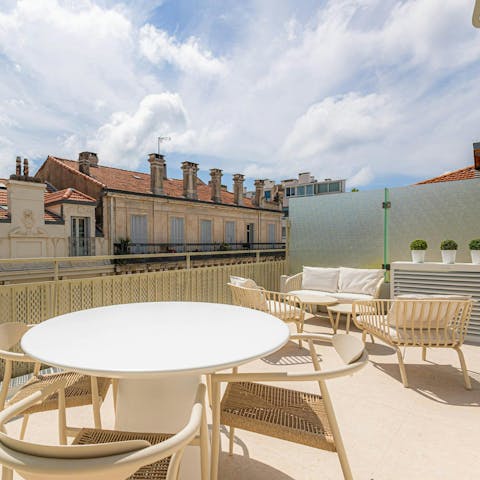 Relax on the sunny terrace with a glass of Champagne