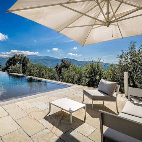 Take a seat by the pool and soak up the views