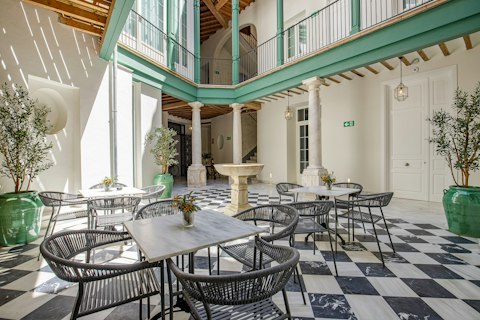Catch up on some work in the shared Andalusian courtyard