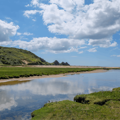 Hop in the car to visit Three Cliffs Bay and its sandy beach