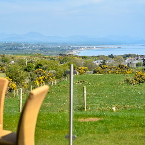 Step out onto the patio and admire the far-reaching view of Cardigan Bay