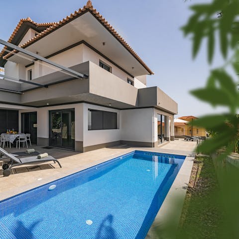Slip into your swimwear and splash about in the villa's heated pool