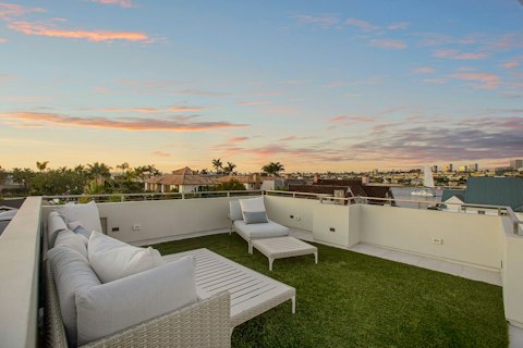 Watch the sky turn pink from the rooftop