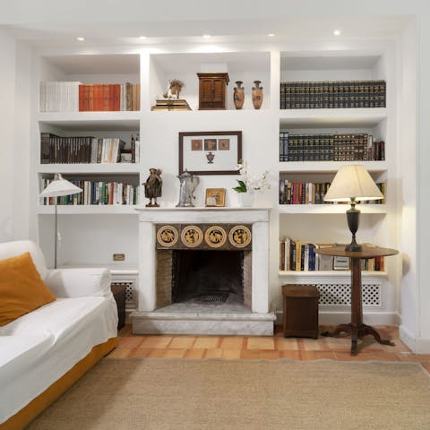 Enjoy cosy nights in sitting by the open fire in your dreamy, book-filled lounge