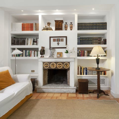 Enjoy cosy nights in sitting by the open fire in your dreamy, book-filled lounge