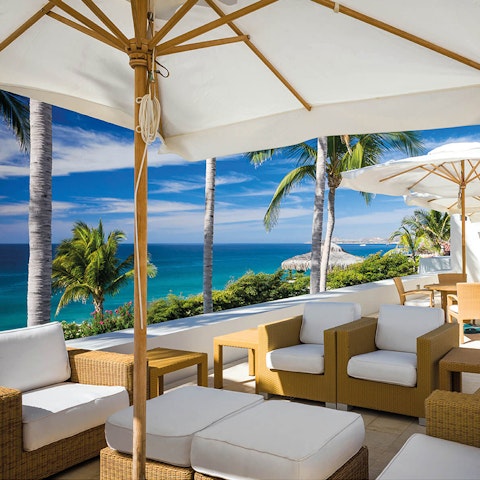 Relax  in the shade with stunning views of the ocean