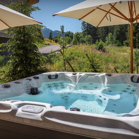 Relax in the hot tub with a glass of Champagne