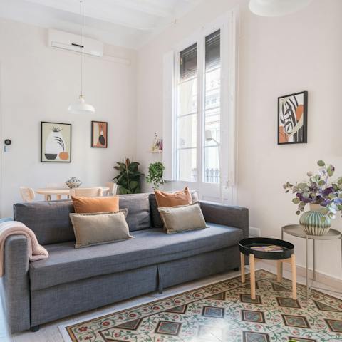 Kick back in the bright living room after a long day of touring the city