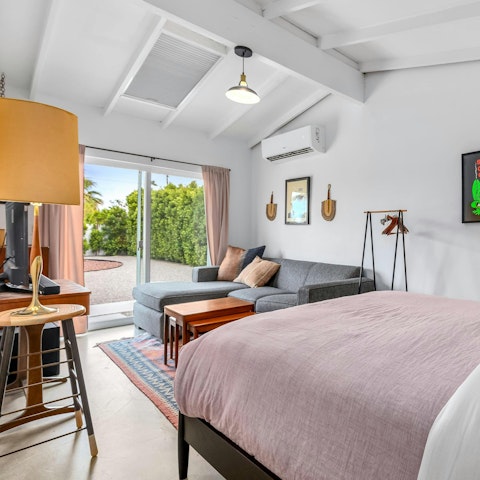 Pad out onto the terrace from the primary bedroom suite