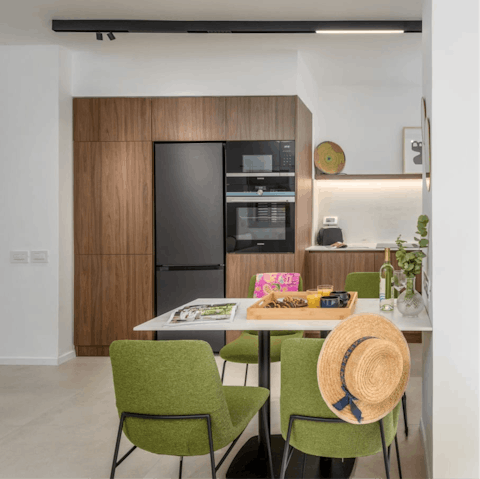 Whip up hummus in the sleek kitchen