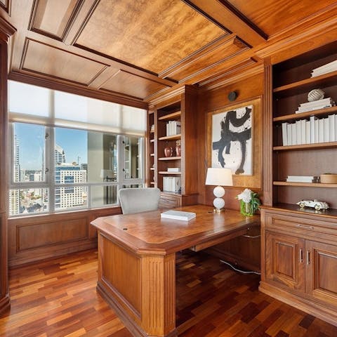 Work or read in style in the wood-panelled office space
