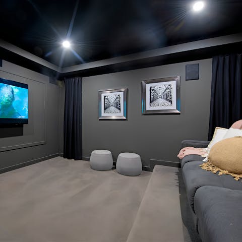 Cosy up for a movie night in the home cinema room