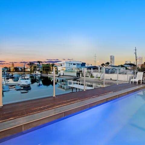 Enjoy waterside views from the heated swimming pool