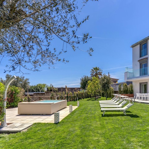 Spend sunny days chilling by the pool