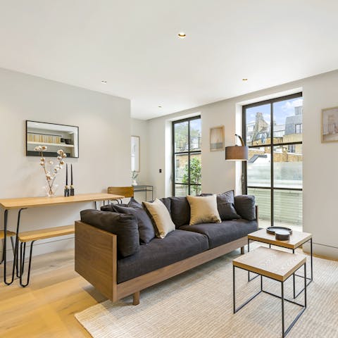Relax in the light-filled living space after a busy day in the Big Smoke