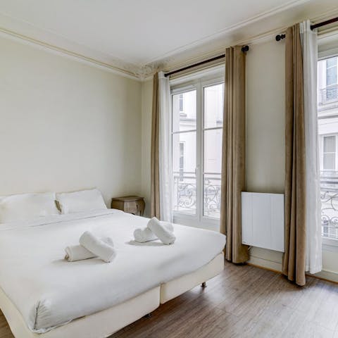 Wake up to sunshine streaming through floor-to-ceiling windows