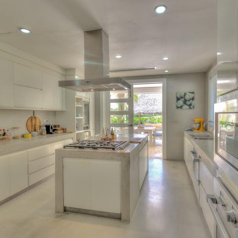 Put the contemporary kitchen through its paces or leave it to the home's private chef