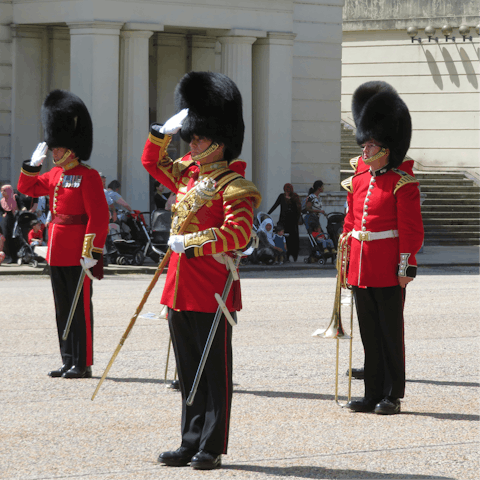Watch the changing of the guard at neighbouring Buckingham Palace