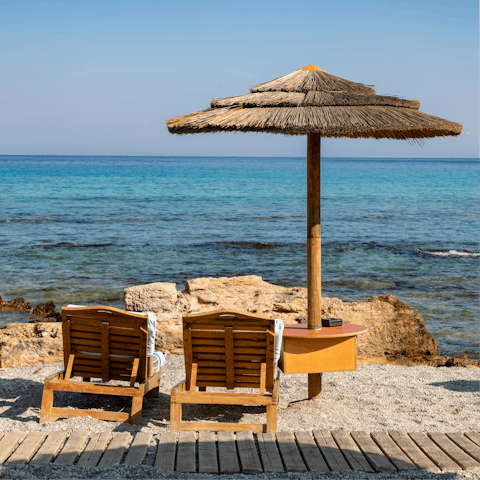 While away the hours on the shores of Paralia Faliraki, a five-minute drive away