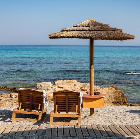 While away the hours on the shores of Paralia Faliraki, a five-minute drive away