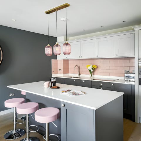 Cook tasty treats in the pastel-pink kitchen