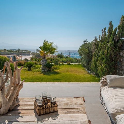 Watch the sun set across the horizon and raise a glass to the beauty of island living