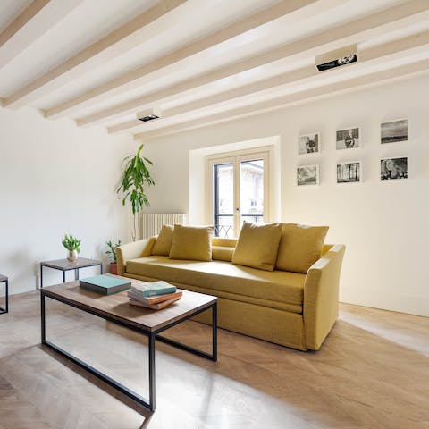 Fix a Campari soda to share in the light-filled living room